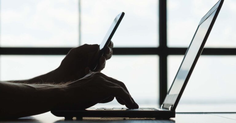 STUDIO FIVE: Adaptive Websites - Silhouette of hands using devices