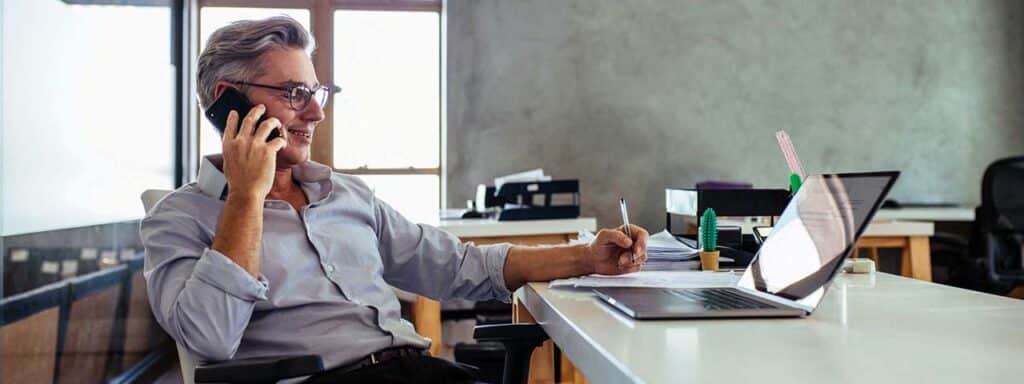 STUDIO FIVE - Increasing Website Engagement: A man working at a desk with a laptop.