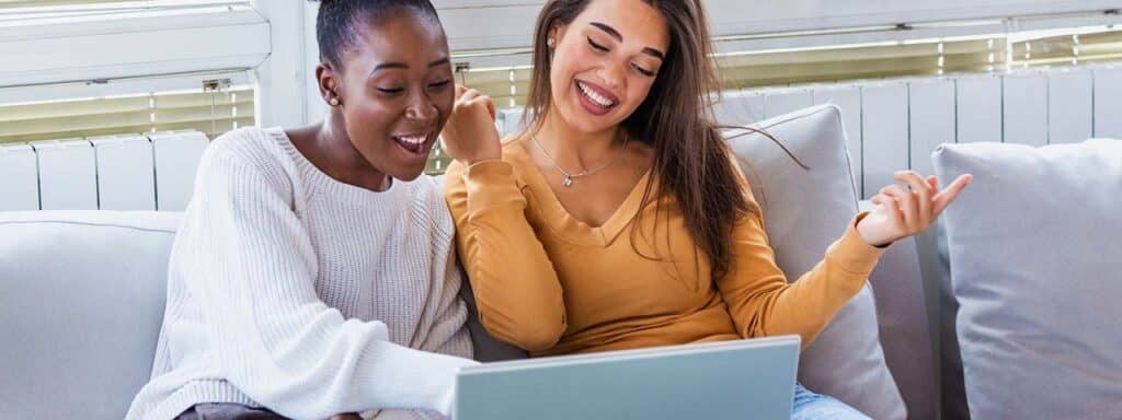 STUDIO FIVE - Increasing Website Engagement: Two people engaged with a laptop.