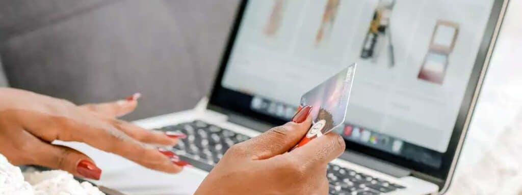 STUDIO FIVE - Reducing E-Commerce Shopping Cart Abandonment: Person shopping online with credit card